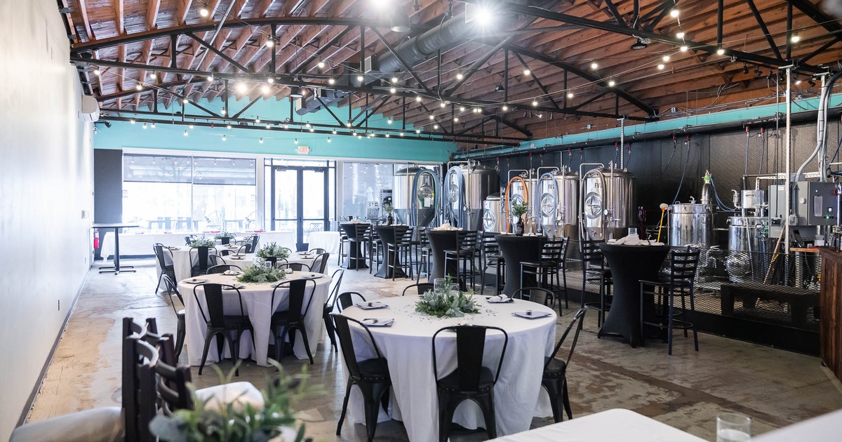 Interior, spacious dining area with tables set for guests