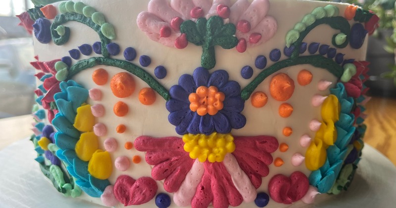 Otomi embroidery style cake.  Butter cream piped in Mexican floral design.