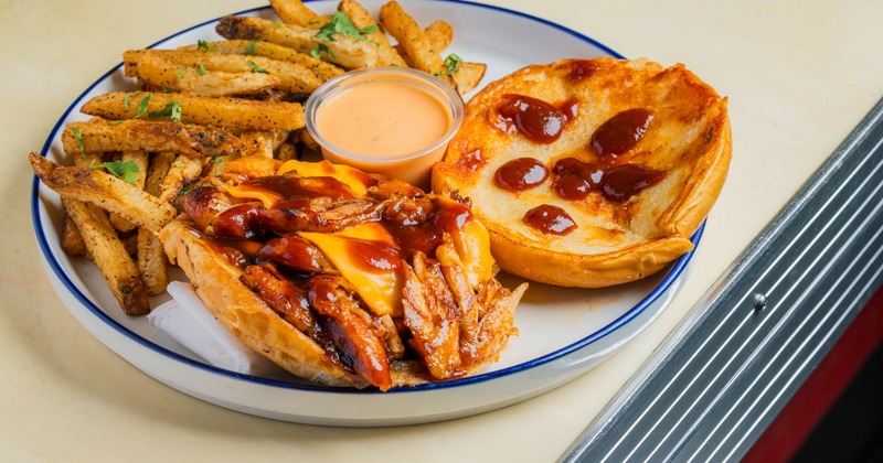 BBQ chicken wing sandwich and fries