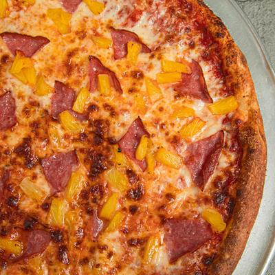 Hawaiian Pizza, with tomato sauce, mozzarella, ham, and pineapple.
