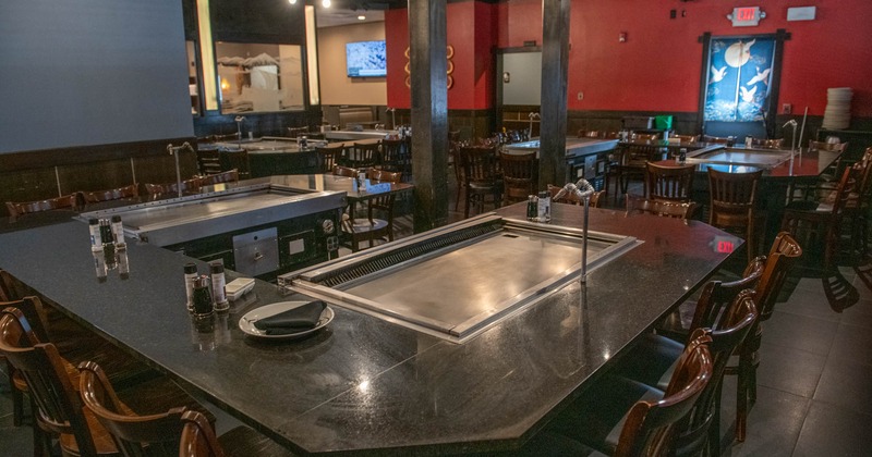 Interior, dining area, marble top table with hibachi grill, chairs, ready for guests