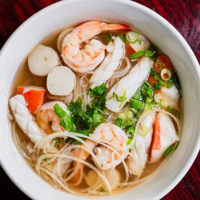 Seafood noodle soup with shrimp and scallions.