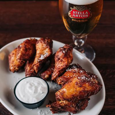 Chicken wings, with dressing, and beer.
