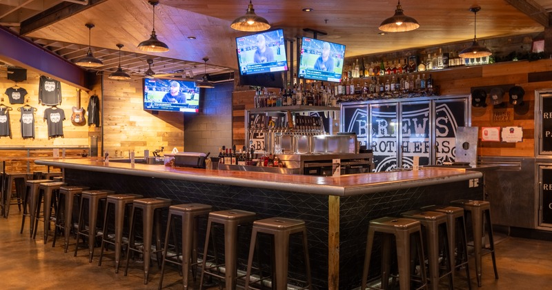 Bar, stools, drink rack, tv screens