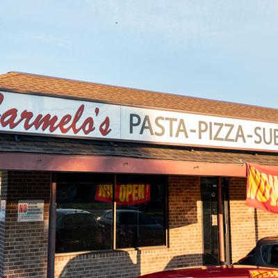 Exterior, front view, entrance, sign above.