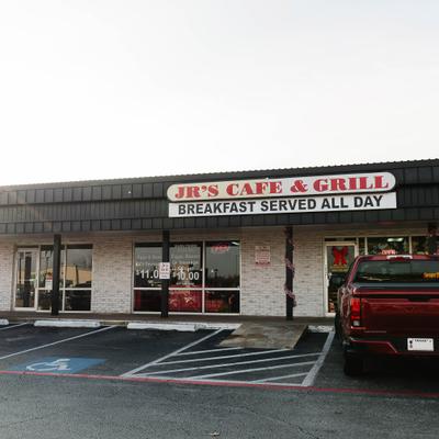 Jr’s Cafe and Grill storefront with a sign advertising breakfast served all day.