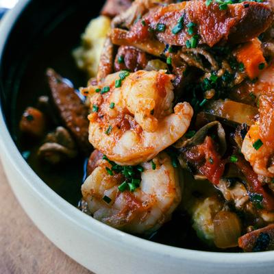 A close up view of shrimp and grits plate.