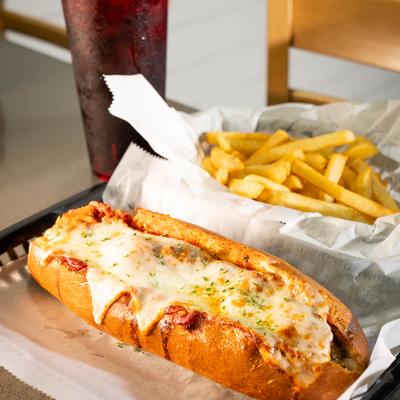 Meatball sub with a side of fries.