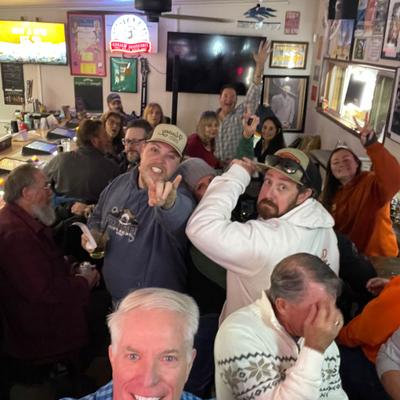 Interior, lively bar ambiance.