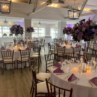 Dining tables with floral centerpieces.