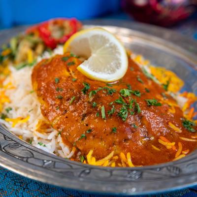 Baked tilapia topped with tomato sauce served with saffron basmati rice.