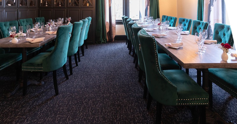 Interior, seating area, tables and green chairs