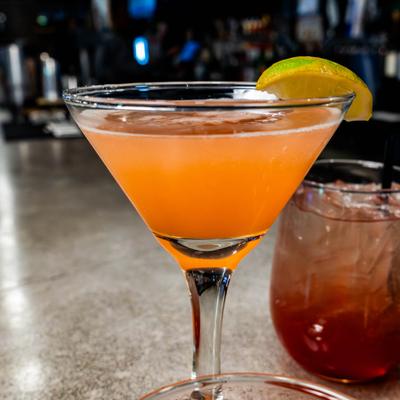 Three cocktails on bar counter.