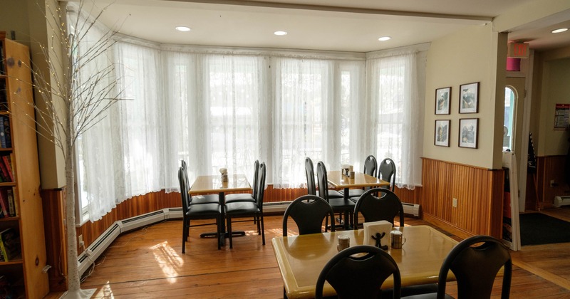 Interior, tables and chairs near window