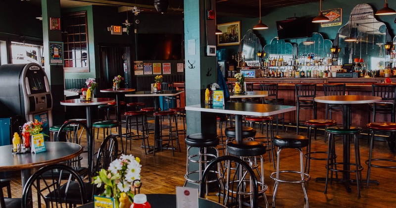 Interior, wide view of seating area, tables and chairs