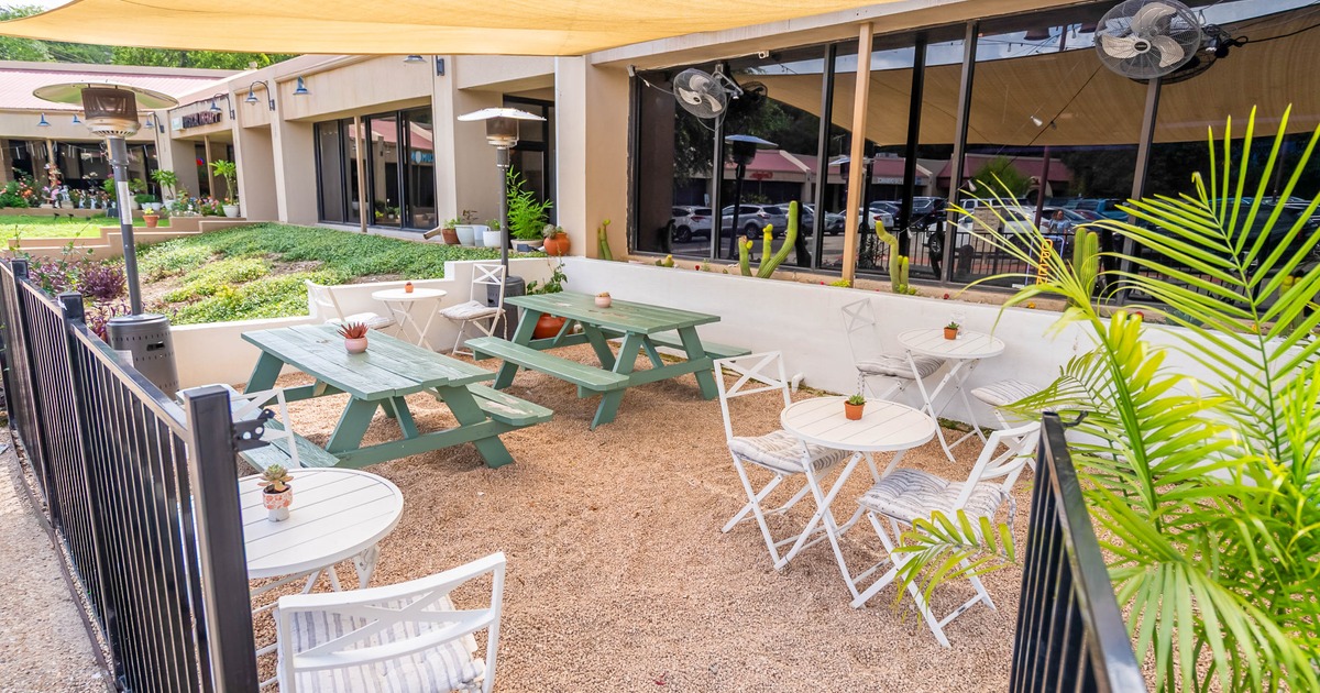 Outdoor patio with tables, chairs and picnic tables