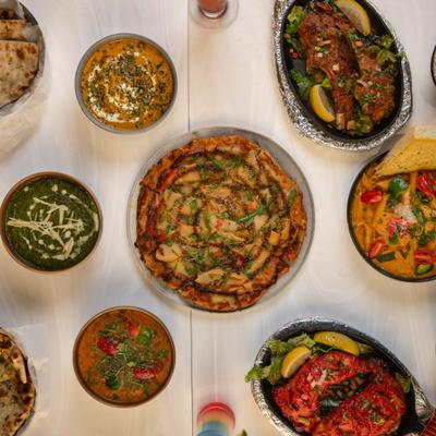 Assortiment of menu items served on the table, top view.