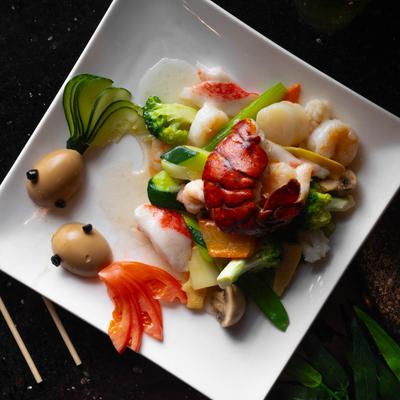 Mixed seafood, sauteed with veggies.