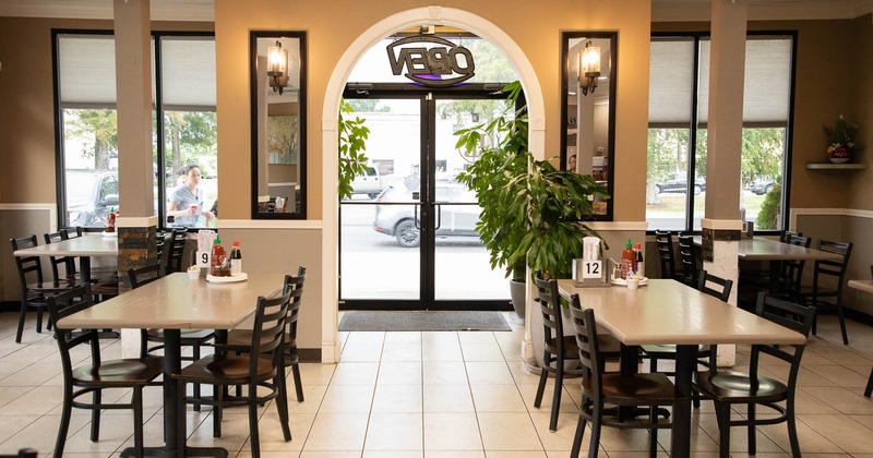 Interior, tables and chairs near entrance