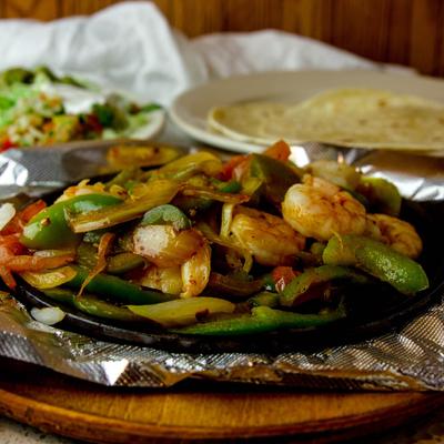 Shrimp Fajita, with onions, tomato, and bell peppers.