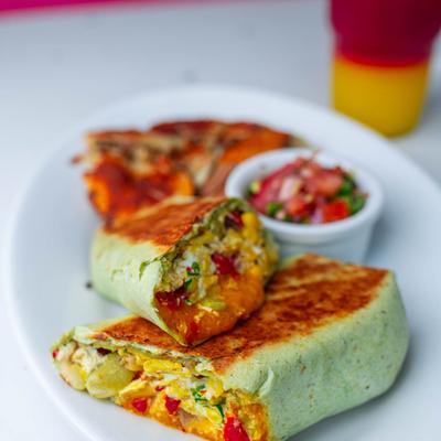 Burrito with scrambled egg, cut in half.