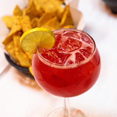 Red cocktail with ice