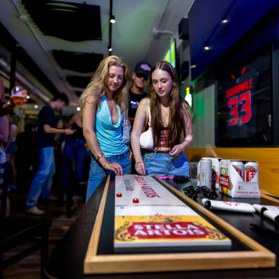 Two women play a game.
