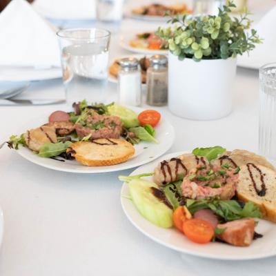 Plated tartar salad with sliced toasted bread.