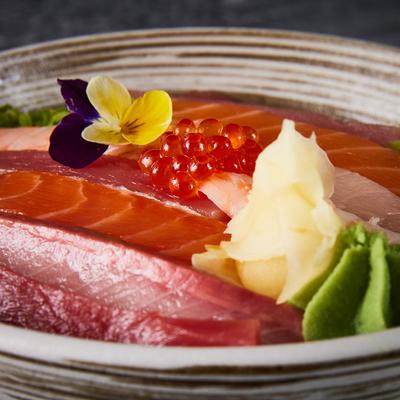 Tuna and salmon sashimi topped with roe.