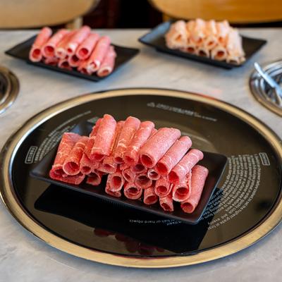 Raw Wagyu Chunk Eye served rolled on the plate.