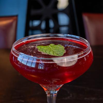 Genesis hand-crafted cocktail, close up. Happy Hour Daily 3-6pm..