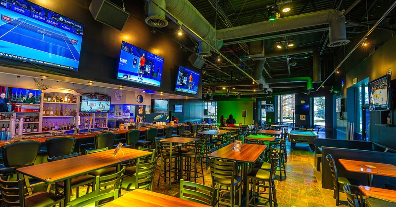 Spacious sports bar interior space, seating area and bar area