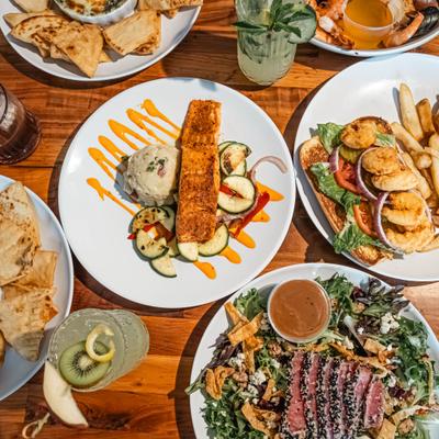 Various dishes served on the table, overhead view.
