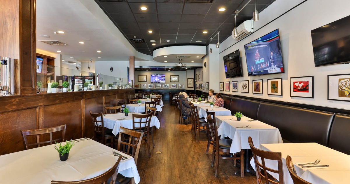Interior, dining area, tables with chairs, long banquette bench with tables and chairs