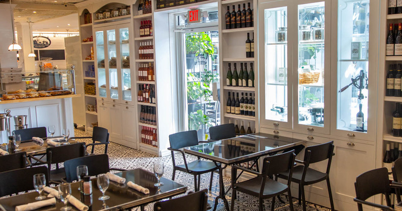 Interior, seating area, lots of bottles and various types of dishes