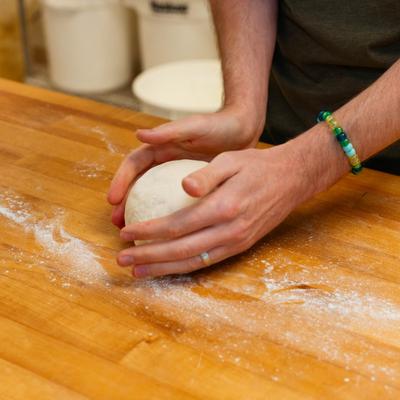 Baker making dough.
