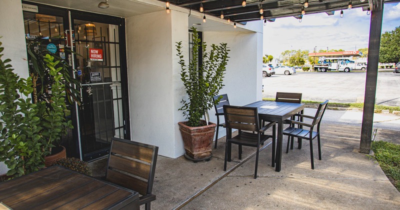 Exterior, tables by the entrance