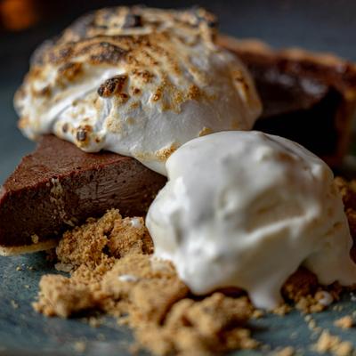 A slice of chocolate pie topped with toasted meringue.