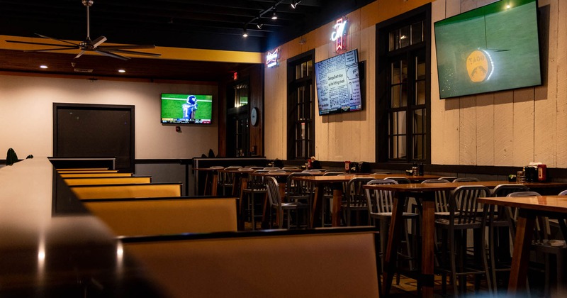 Interior, booth area on the left, tables and chairs on the right