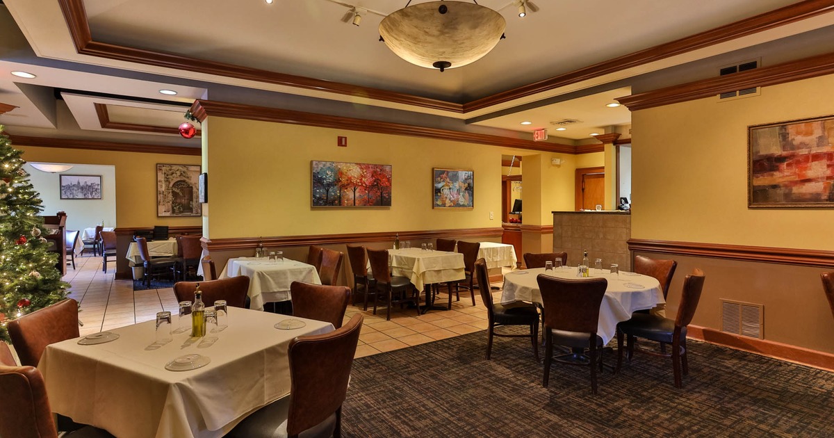 Interior, dining area, tables ready for guests, Christmas tree in the back