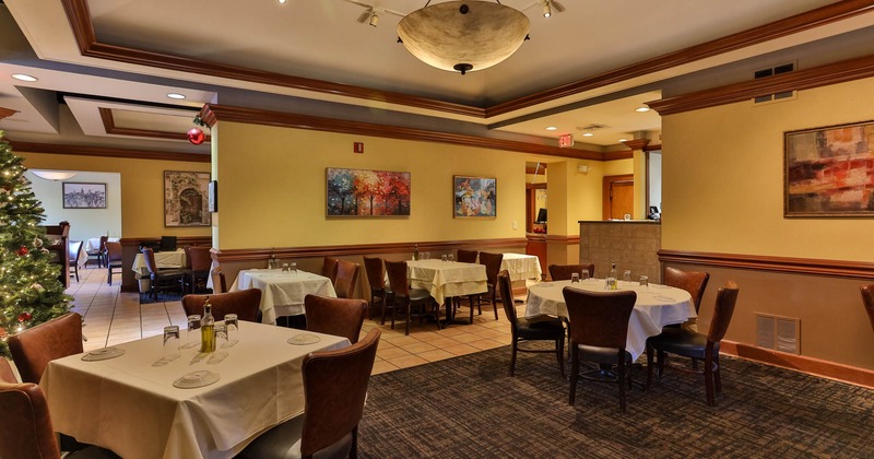 Interior, dining area, tables ready for guests, Christmas tree in the back