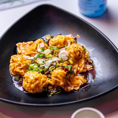 Wonton in spicy sauce.