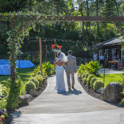 Bride and groom walking towards the enterance of the restaurant