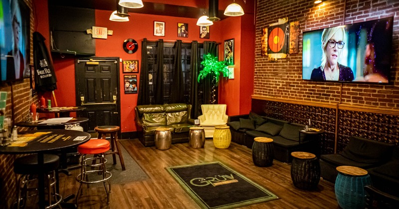 Interior, black sofas and small tables