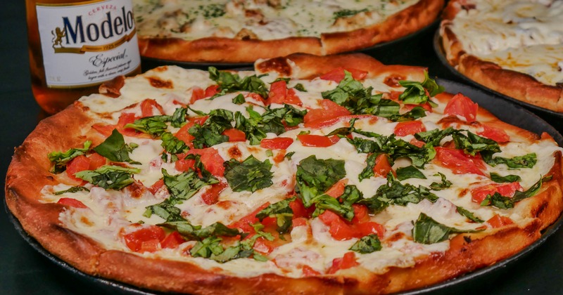 Margherita pizza with fresh basil garnish