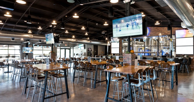 Interior, seating area with high tables and chairs