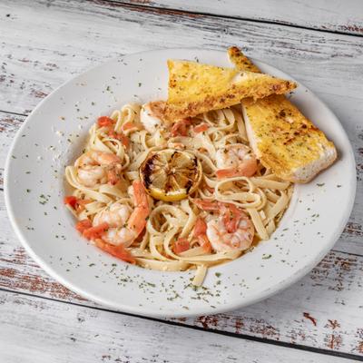 Shrimp Scampi, served with garlic bread