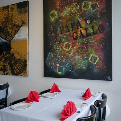 Interior, set table, paintings on the wall