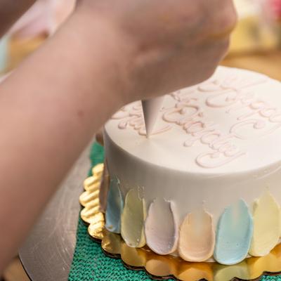 Applying cake icing.