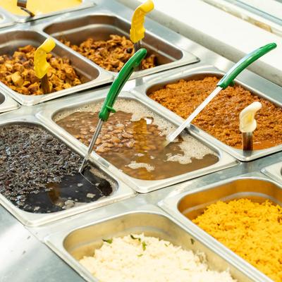 Buffet trays of Mexican food.